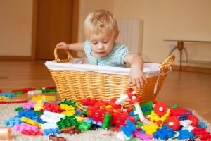 How to teach a child to clean toys with him